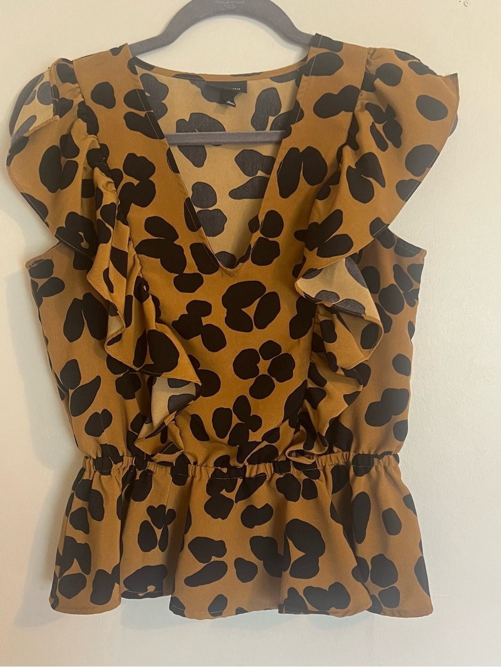 Ruffle Sleeve V-Neck Peplum Top in Brown Animal Spot